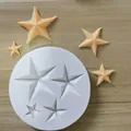 Detailed view of a white circular silicone mold featuring multiple 3D star-shaped cavities - 4 Stars / White