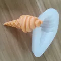 Detail of a white silicone ice cream cone mold showing a realistic orange cast product. - Ice Cream Cone Mold / Style 1