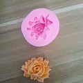 Detail shot of pink silicone flower mold and finished orange floral plaster cast - No. 3 (Mini Style)