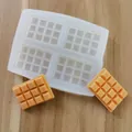 Detailed view of 4-cavity silicone chocolate mold with finished orange fondant bars - Chocolate Shape / Full Chocolate Bar Shape
