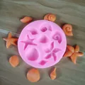 Detailed pink silicone mold with ocean starfish and shell shapes for fondant decoration. - Ocean Theme (Starfish Shell) / Pink