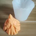 Detail of 3D iceberg silicone mold next to an orange mountain-shaped finished product. - Iceberg Shape / 8.3x7.5cm / Random Color