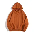 Macro detail view of the orange men's hoodie showing the intricate cable knit pattern - XS / Tops / Orange Red