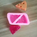 Detail van roze siliconen kaasvorm met oranje en rode fondant voorbeelden - Stijl 3