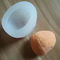 Detail showing a 3D stone-shaped silicone mold next to a textured plaster sample - Stone Shape