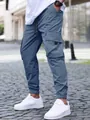 Men's blue cargo joggers with drawstring waist and elastic cuffs in outdoor setting - S / Bottoms / Blue