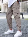 Men's khaki cargo joggers featuring elastic drawstring waist and large side pockets - S / Bottoms / Beige Grey