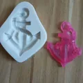 Detailed view of nautical anchor-shaped silicone mold with pink fondant result - Anchor Shape / White
