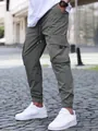 Detailed view of men's olive green cargo joggers with elastic drawstring waist and cuffs - Charcoal Gray
