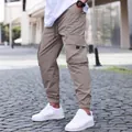 Men's khaki cargo joggers with drawstring waist and side pockets for outdoor streetwear. - S / Bottoms / Beige Grey