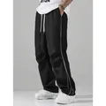 Men's black high street track pants with white side stripes and drawstring waist - S / Bottoms / Black