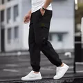 Men's high street black cargo joggers with vintage decorative patch and elastic cuffs - S / Bottoms / Black