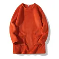 Detailed macro view of orange plush long-sleeved sweatshirt with front pockets texture - Orange Red
