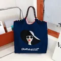 Stylish navy blue nylon tote bag with large lady embroidery and white text detail - Navy Blue - Sunglasses Lady