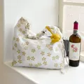 Fresh Korean-style white floral shoulder bag with a cute yellow croissant charm SKU - Cream Floral