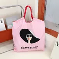 Pink nylon eco bag with elegant woman embroidery and large capacity for commuting. - Pink - Sunglasses Lady
