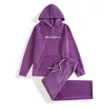 Detail view of a purple fleece men's tracksuit set featuring white 'Muscleattack' embroidery. - S / Top And Bottom / Purple