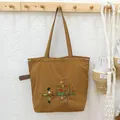 Brown Japanese-style embroidered tote bag with drawstring closure for daily commute. - Khaki Lotus