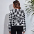 Back view of a black and white checkered chiffon blouse with elastic waist and lantern sleeves - S / Tops / Checkered