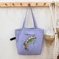 Light purple canvas tote bag with playful cat embroidery and drawstring closure feature - Purple Fat Orange Cat