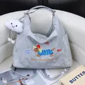 Fashionable small silver crossbody bag with cute dog embroidery and cloud charm - Bag With Cloud Pendant / Silver