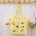 Yellow drawstring tote bag featuring embroidered cute cartoon dogs for casual daily use. - Yellow Dachshund Family