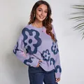 Lifestyle detail showing a woman in a purple knitted sweater with floral patterns - S / Tops / Purple