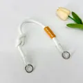 Minimalist white nylon braided bag strap featuring an orange label and knot detail. - Short Hand-Knotted Rope / White