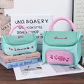 High-capacity mint green and pink portable cosmetic storage bag with cute cartoon embroidery - S / Cyan