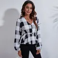 Elegant detail view of a V-neck buffalo plaid chiffon blouse with cinched waist - S / Tops / Black and White Large Plaid