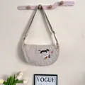 Beige minimalist crescent bag featuring cat embroidery and an adjustable shoulder strap - Cat Playing / One Size / Beige