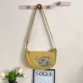 Yellow embroidered crescent bag with cat design and adjustable strap for women - Teacup Cat / One Size / Turmeric