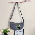 Minimalist grey nylon dumpling crossbody bag featuring detailed panda embroidery - Panda Eating Bamboo / One Size / Gray
