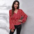 Elegant red and white gingham V-neck blouse with lantern sleeves and cinched waist design - Red Grid