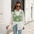 Detailed shot of women's green mushroom jacquard knit vest in casual street style outfit. - S / Tops / Light Green