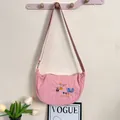 Pink nylon dumpling bag with cartoon embroidery and adjustable strap - Pink