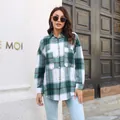 Outdoor lifestyle shot of a woman wearing a green and white plaid flannel shirt jacket - S / Tops / Green