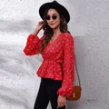 Detail view of red floral V-neck chiffon blouse with lantern sleeves and cinched waist - S / Tops / Red Background Small Floral