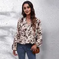 Chic V-neck chiffon blouse with abstract brown floral print and lantern sleeves. - Brown Stone Print
