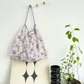 Large floral canvas tote bag for resort beach vacations hanging in a home setting - Purple Ink Painting