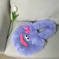 Adorable purple fluffy plush tote bag featuring a cute cartoon face and pink bow detail - Purple