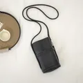 Elegant black soft leather crossbody phone bag with wavy trim detail for women's use - Black