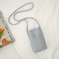 Premium light blue soft leather mini crossbody phone bag with scalloped edge detail. - Blue