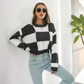 Detailed view of women's black and white checkerboard long sleeve cropped knit sweater - S / Tops / Black