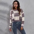 Close-up view of a chic purple and white checkerboard jacquard knit cropped sweater for women. - S / Tops / Purple