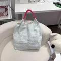 Detailed view of a fresh floral quilted tote bag with pink rope handles - M / Green Fireworks