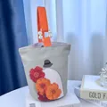 Artistic canvas bucket bag featuring floral embroidery and elegant pearl strap detail - Girl and Floral Art Print (02)