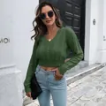 Detail of green cable knit V-neck cropped sweater with a classic textured pattern. - S / Tops / Army Green