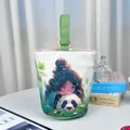 Canvas bucket bag featuring a vibrant artistic illustration of a cute girl and a panda - Panda Camping (03) / Off-White (Dark Green Handle)
