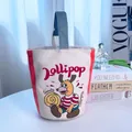 Stylish canvas bucket handbag featuring a cute cartoon dog print and Lollipop text - White Dog